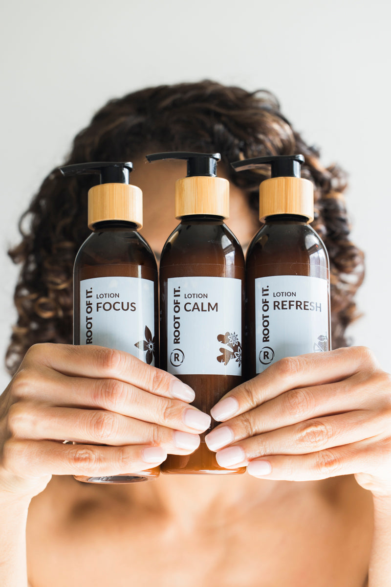women holding bottles of lotion